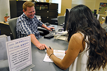 Financial aid staff assisting a student